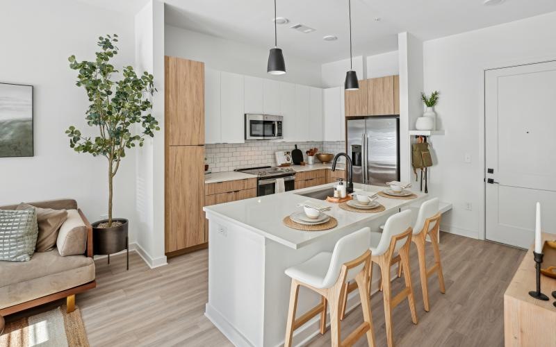 a kitchen with a dining table and chairs