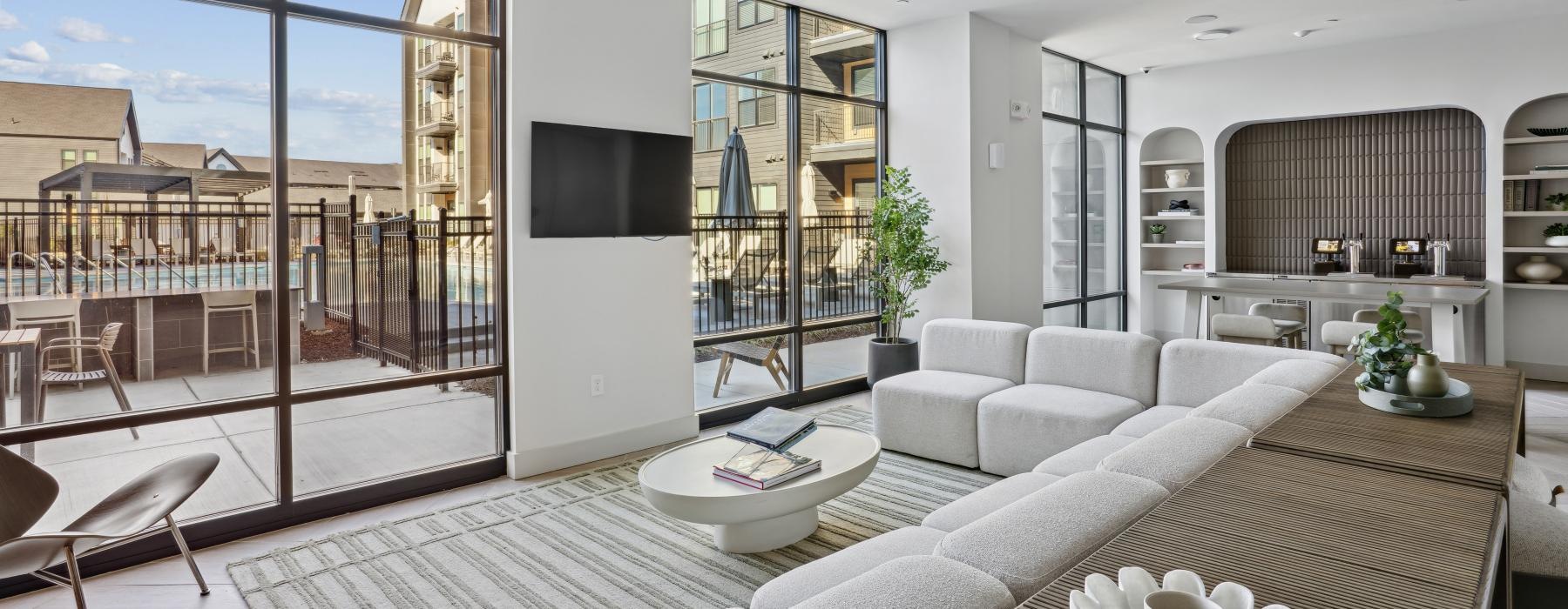 a modern looking living room with a large glass wall